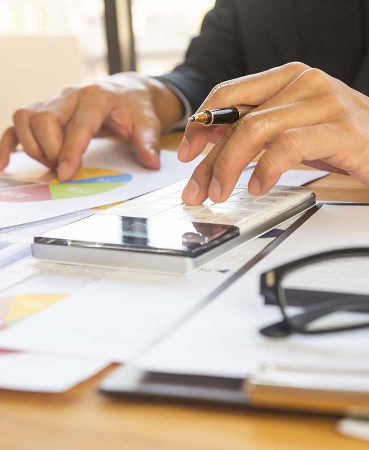 Businessman Or Accountant Working On Calculator To Calculate Bus